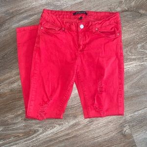 Red distressed denim